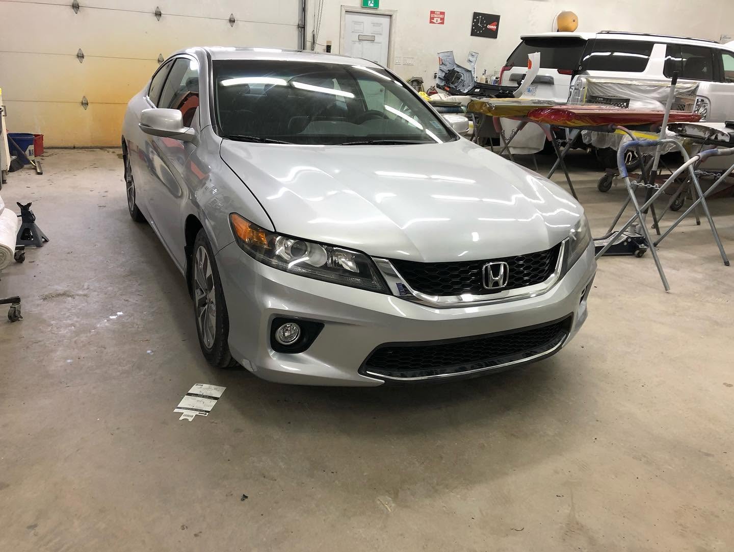 Silver Honda Accord coupe rebuilt after a collision