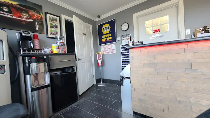 The JC AutoWorks front desk with its NAPA certified body shop sign